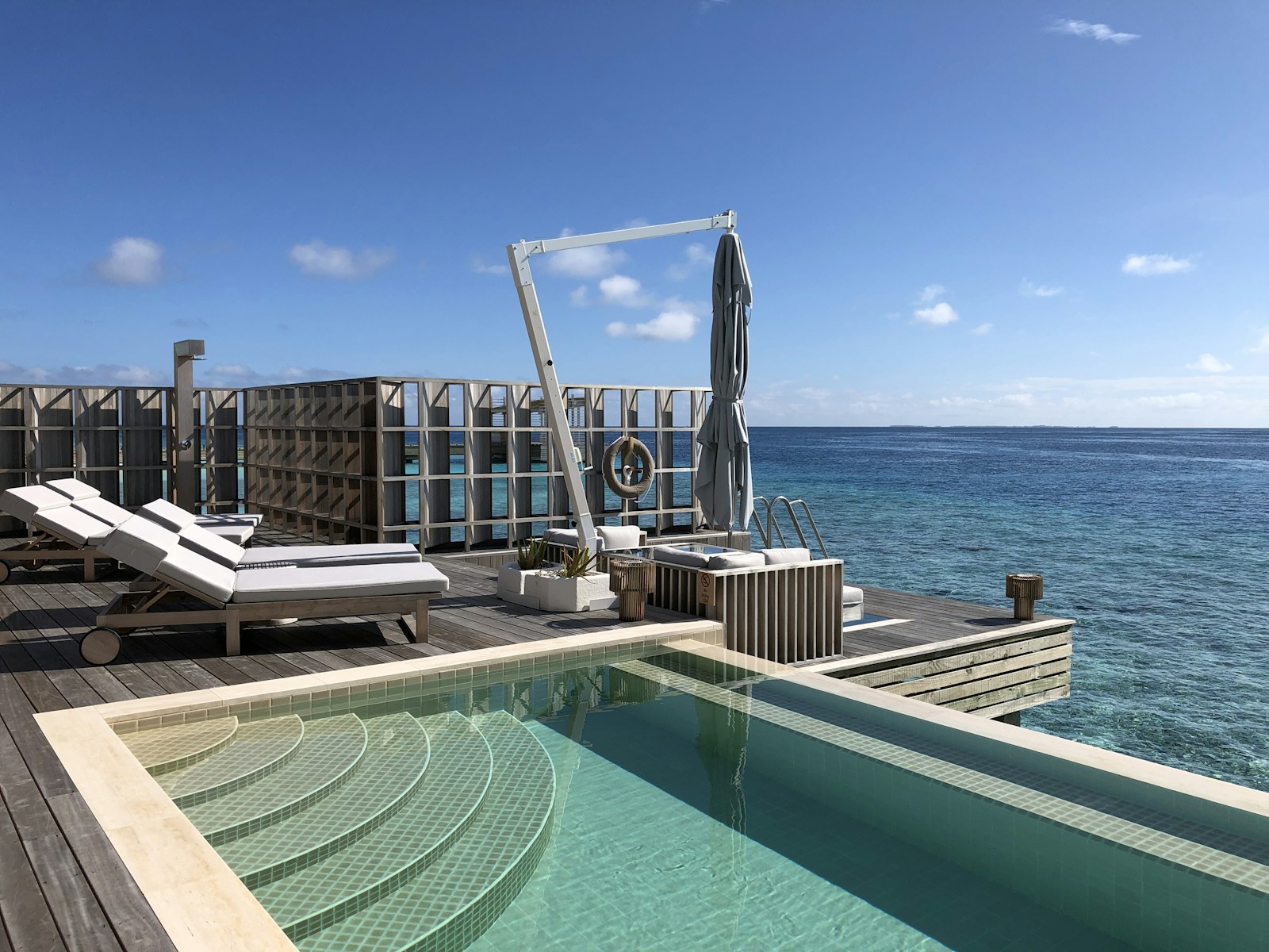 A hotel pool overlooking the ocean